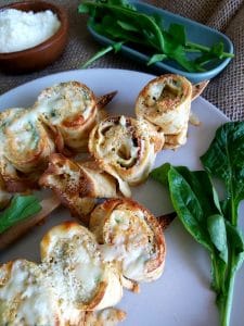 Stuffed crepe skewers on a plate