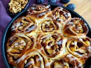 Plum Cinnamon Rolls in a baking dish.