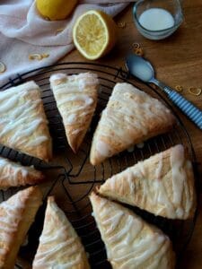Lemon scone wedges on a wire rack.
