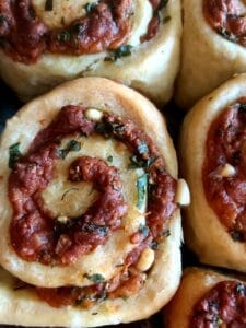 Close-up of freshly baked cheese and garlic rolls. 