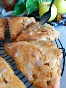 Close-up of baked Apple Cinnamon Scones on a wire rack. 