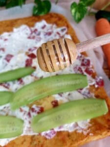 Close-up of honey drizzled over creamy filling.
