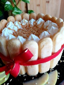 Golden Caramel Apple Charlotte tied with a ribbon for serving.