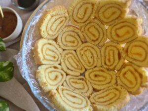 Thinly sliced Swiss Roll arranged in a lined bowl to create the dome for Charlotte Royal.