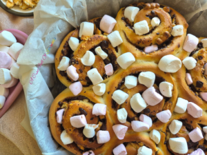 Pre-baked S’mores Sweet Rolls topped with mini marshmallows.