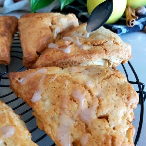 Close-up of baked Apple Cinnamon Scones on a wire rack.