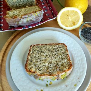 Slice of a Lemon Poppy Seed Loaf on a white plate.