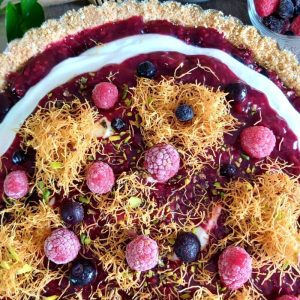 Kataifi berry tart with crisp golden pastry nests, smooth yogurt cream filling, and fresh summer berries.
